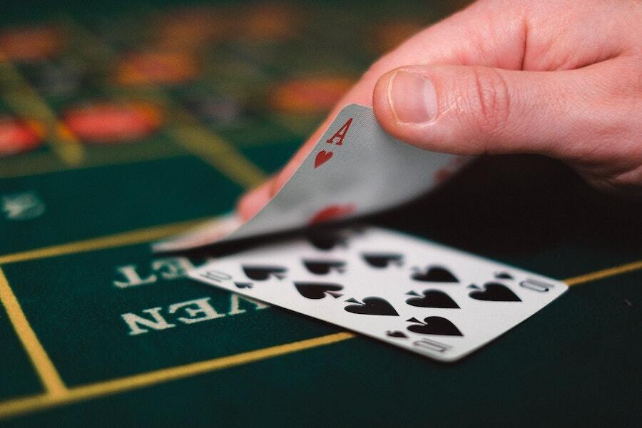 player checks their blackjack hand to see an ace and a 10